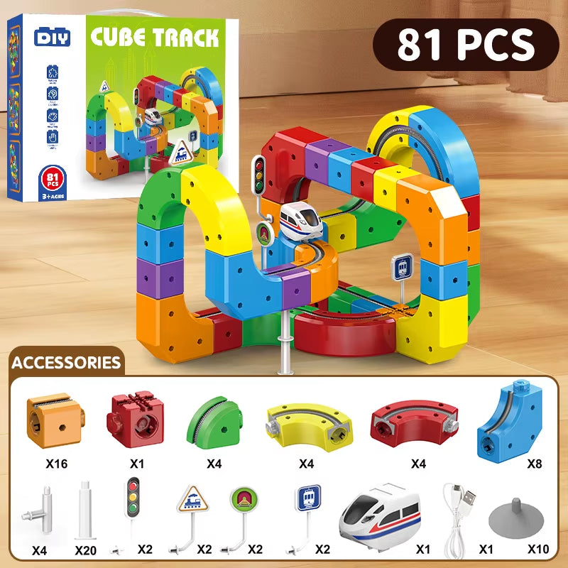 Colorful toy track set with accessories on a wooden surface, including packaging and small train model.